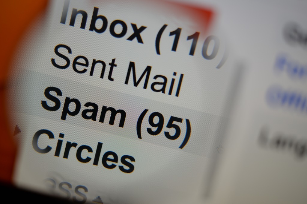 magnifying-glass-showing-spam-folder