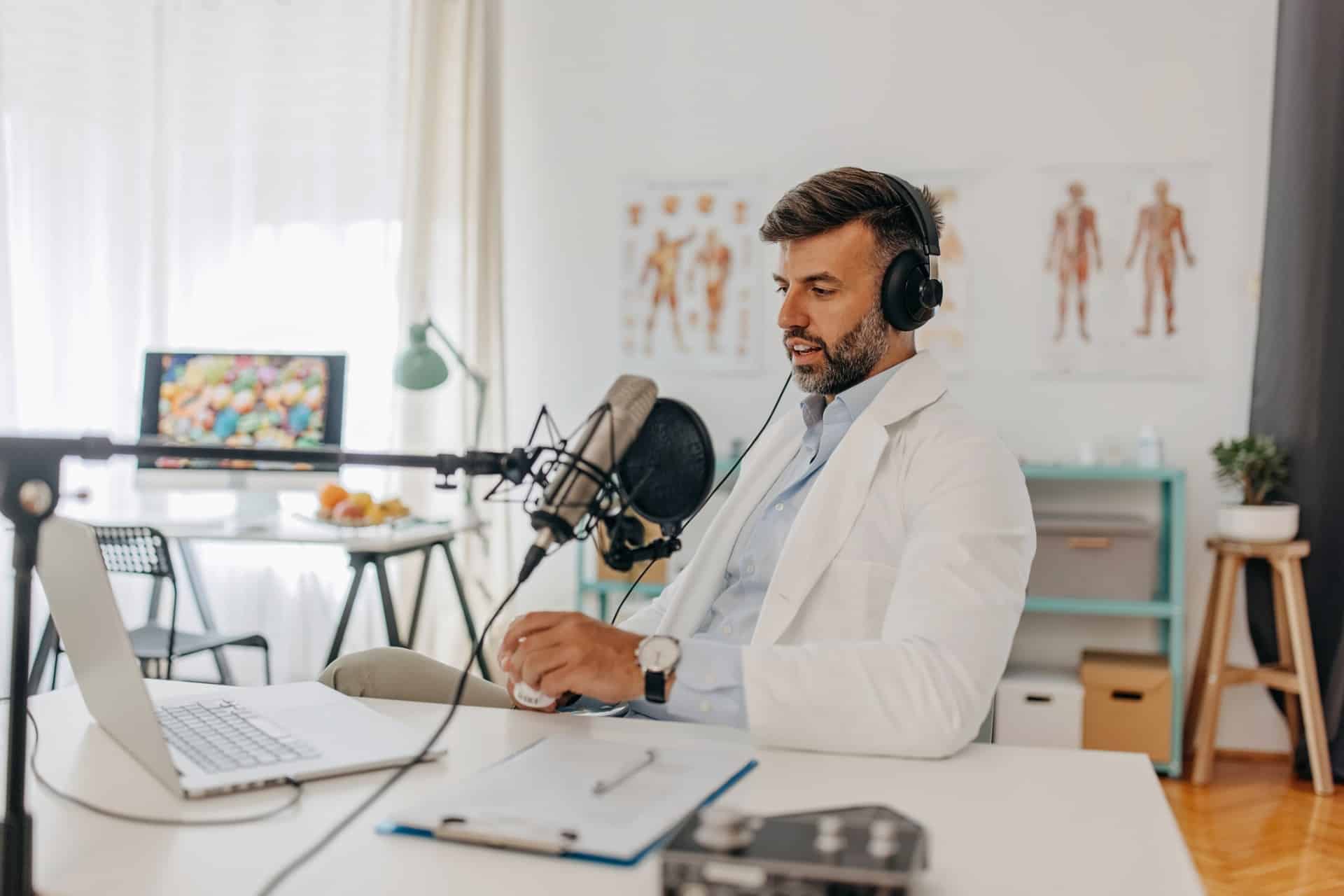 This is a photo of a man recording a podcast for his business's content marketing strategy.