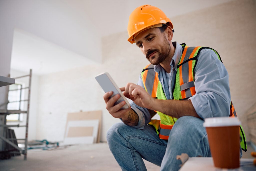Contractor-checking-phone