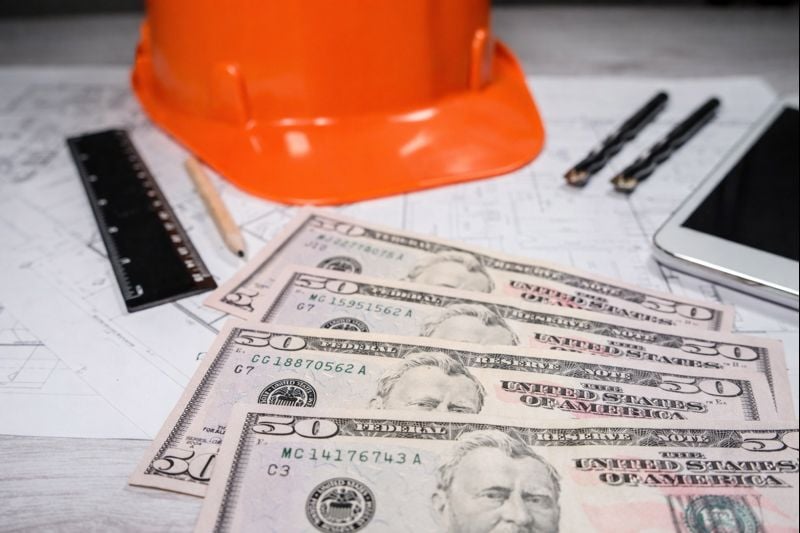 orange-hard-hat-money-blueprints-contractor-cash-flow